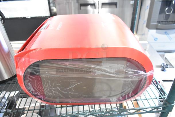 Georgia Pacific enMotion red poly wall mount paper towel dispenser, brand new, minor scratches, wrapped in plastic.