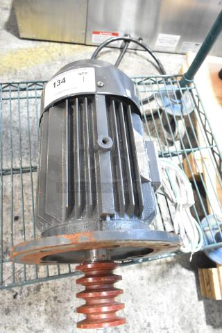 BRAND NEW SCRATCH AND DENT! Y100L2-6 Motor with visible surface rust and sale sticker.