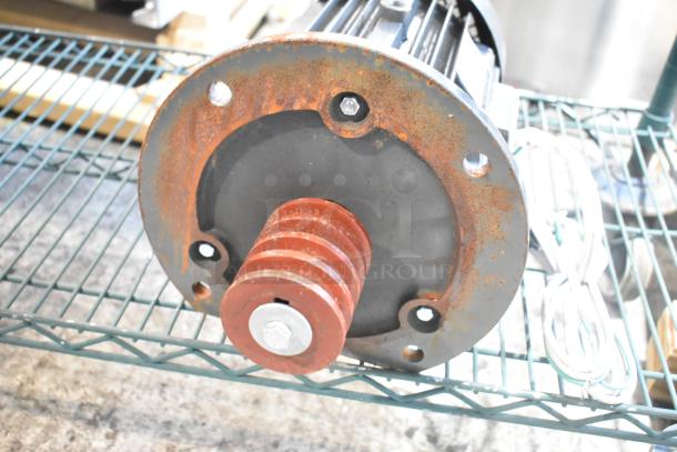BRAND NEW Y100L2-6 Motor with minor rust on the flange. Unused condition, visible scratches and dents. Includes wiring.