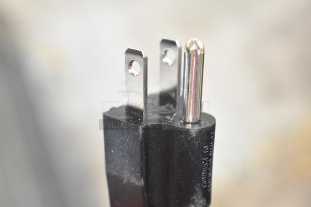 Close-up of the power plug for a Carnival King 382RBD5G3 Triple 5 Gallon Refrigerated Beverage Dispenser.