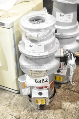 New Hobart FD4/125-3 Commercial Garbage Disposer, 1 1/4 hp, 120/208-240V, short upper housing, scratch and dent condition, model tags visible.