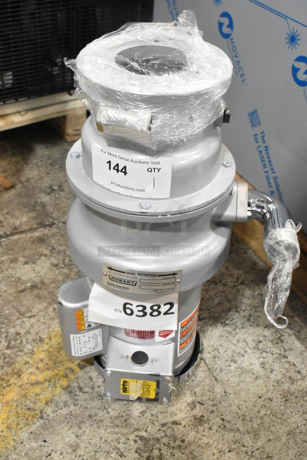 Brand new Hobart FD4/125-3 commercial garbage disposer, 1 1/4 hp, with short upper housing. Scratch and dent condition.