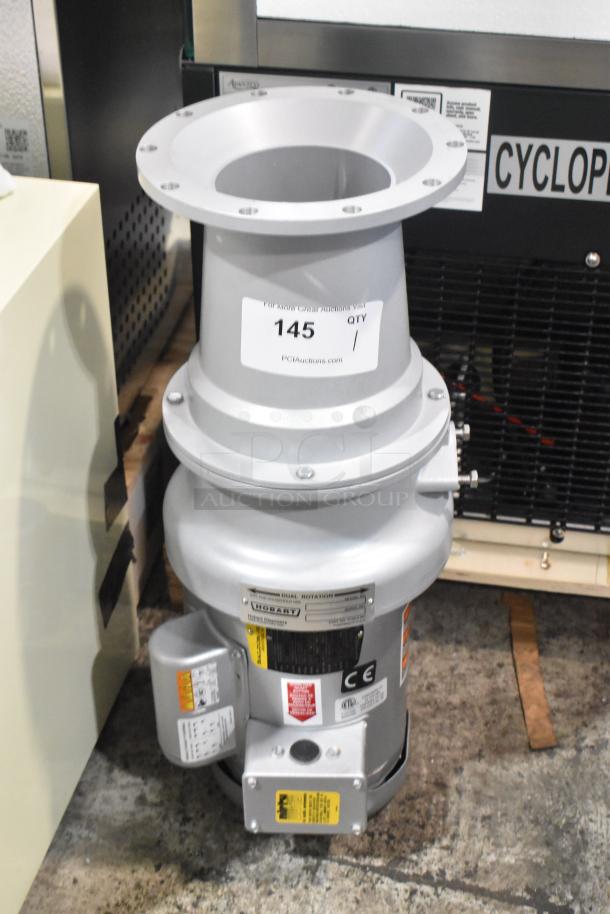 Brand new Hobart FD4/125-4 commercial garbage disposer, 1 1/4 hp, 120/208-240V, with long upper housing, labeled and tagged.