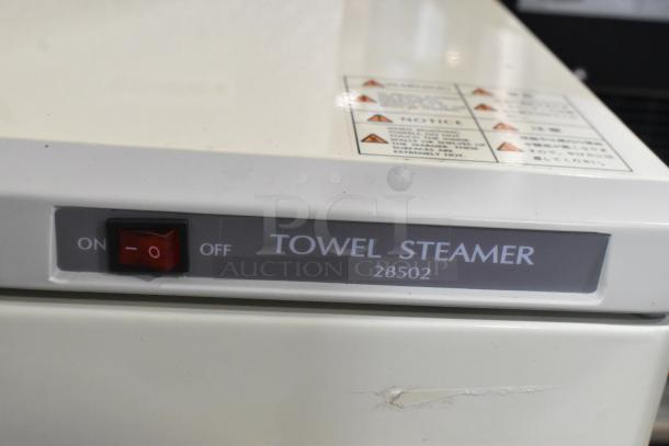 Brand new Town 28502 towel steamer, 160-towel capacity, two compartments, scratch and dent, visible toggle switch and labels.