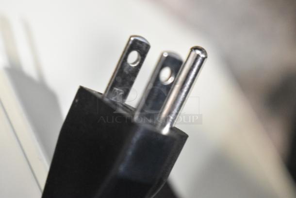 Close-up image of a power plug for a Town 28502 waterless oshibori towel steamer, new condition, 120 volts, 1 phase.