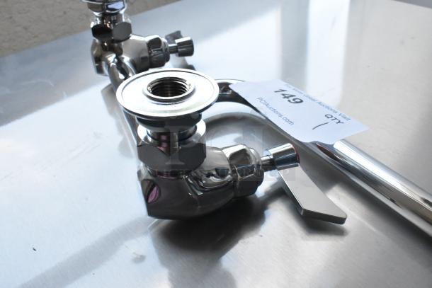 Brand new scratch and dent faucet with handles, chrome finish, auction tag visible, item 149, from PCAuctions.com.