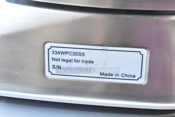 AvaWeigh 334WPC30SS 30 lb. IP68 Waterproof Digital Scale, brand new, scratch and dent. Tag shows "Not legal for trade," serial number, and "Made in China".