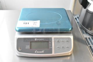 San Jamar Escali SCDGM33 33 lb. digital kitchen scale, new, scratch and dent condition. Features tare function and digital display.