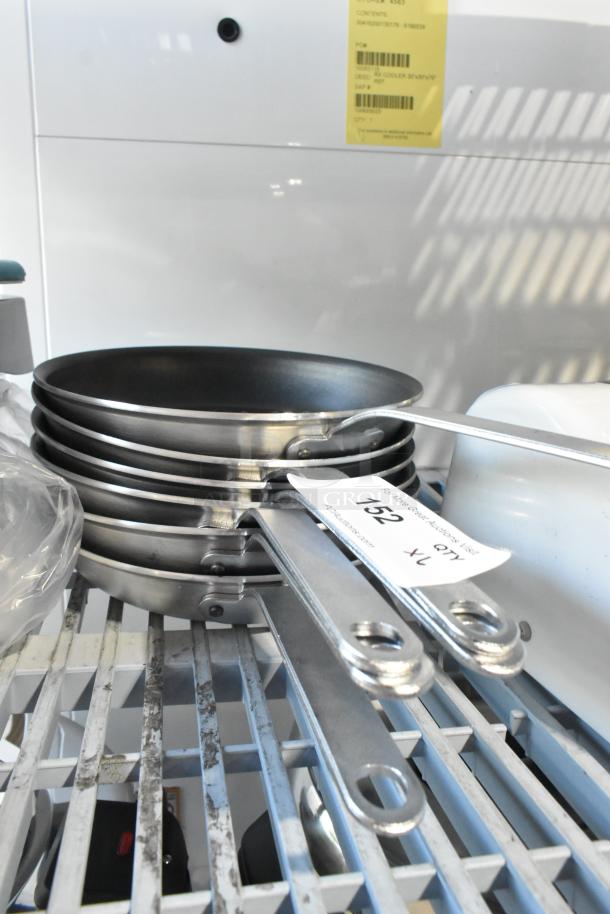 6 new Vigor 473ALFP10EPH 10" aluminum fry pans with non-stick Eclipse coating, plated handles, auction tag visible.