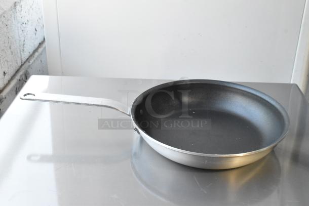 6 brand new Vigor 10" aluminum fry pans, model 473ALFP10EPH, with non-stick Eclipse coating and plated handle.