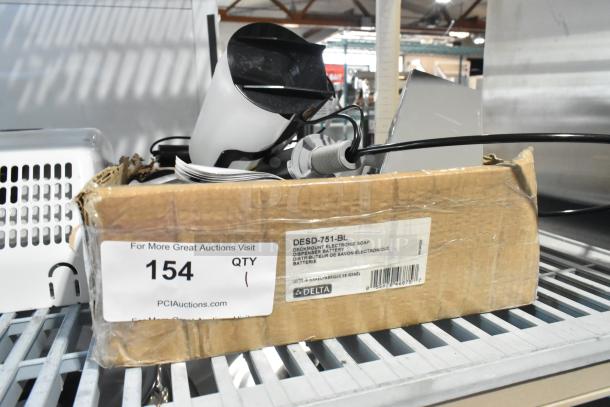 Brand new Delta Faucet DESD-751-BL electronic soap dispenser, matte black finish, scratch and dent condition, in box.
