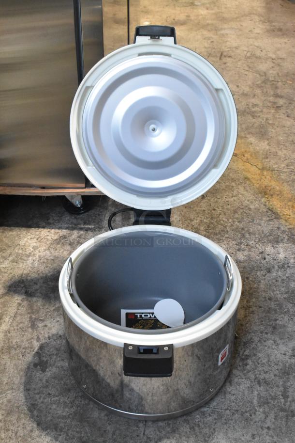 "Brand new Town 56916S 72 cup commercial rice warmer with stainless steel finish, 120 volts, open lid, visible spoon."