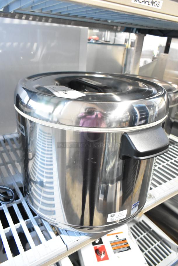 Brand new Zojirushi RDS-600 stainless steel sushi rice container, 66-cup capacity, minor scratches, sturdy handles, labeled.