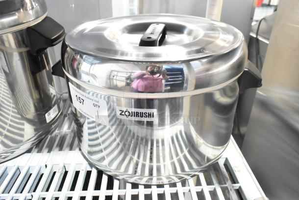 Brand new Zojirushi RDS-400 stainless steel sushi rice container; 44 cup capacity. Slight scratch and dent visible.