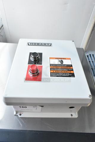 BRAND NEW Hobart control box with scratch and dent. Features warning label, on/off buttons, model label, and manufacturer tag.