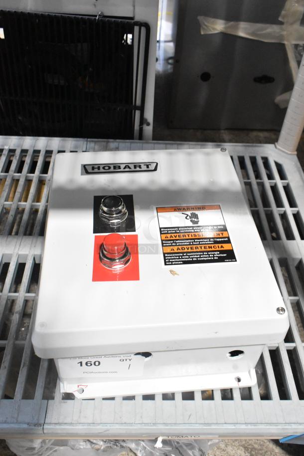 Brand new Hobart control box with minor scratches and dents, features red and black buttons, warning label visible.