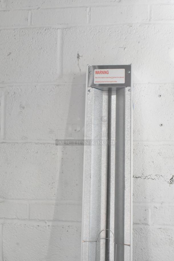 BRAND NEW ServIt 423SW72THA 72" strip warmer, single toggle control, 120 Volt, showing warning label. Scratch and dent condition.