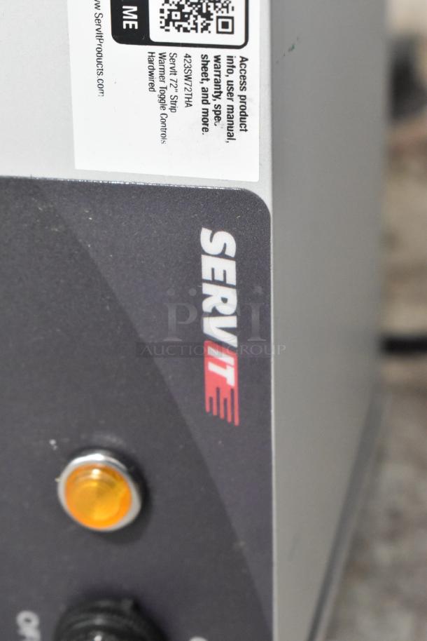 Brand new ServIt 423SW72THA 72" strip warmer with single toggle control, 120V, 1 phase; minor scratches and dents visible.