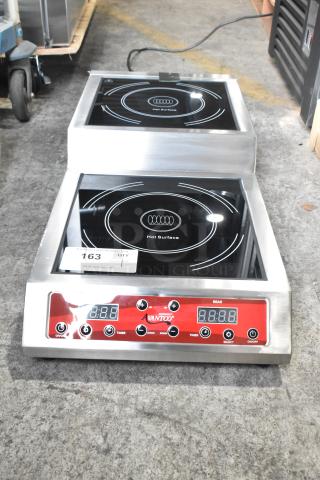Brand new Avantco 177IC35SU stainless steel double countertop step-up induction cooker, 208-240V, with digital controls.