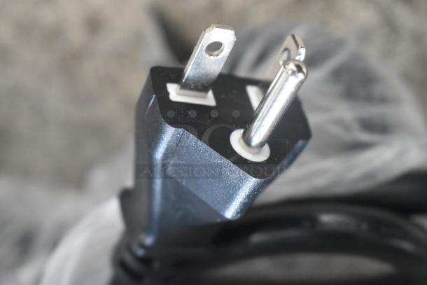 Close-up of a power plug for the Avantco 177IC35SU Stainless Steel Induction Range, showing connection details.