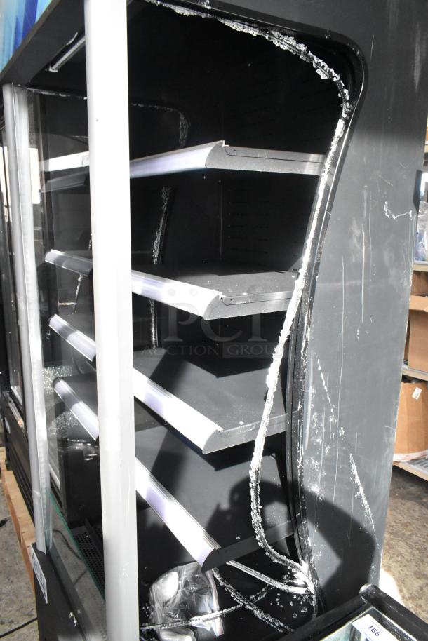 Brand new Avantco 189BVAC28HC 28" black refrigerated air curtain merchandiser with broken glass visible, on commercial casters.
