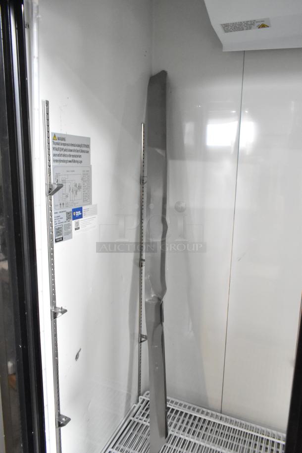 2024 Avantco 178GDS47HCB 53" merchandiser refrigerator, interior view, customizable sliding glass door, LED lighting, minor scratches.