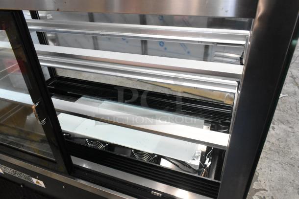 Brand new Avantco 193BC48HCB 48" curved glass bakery display case, black, refrigerated, 115V, 1 phase, minor scratches.