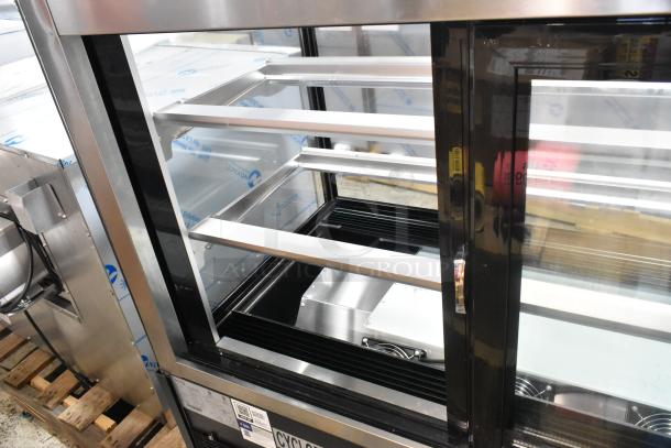 Brand new Avantco 193BC48HCB 48" curved glass refrigerated bakery display case, black, 115 volts, 1 phase, scratch and dent.
