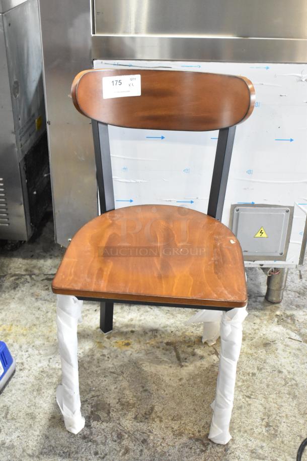 Brand new Cambro metal dining chair with wooden backrest and seat. Scratch and dent condition. Item tag reads "175 QTY XL".