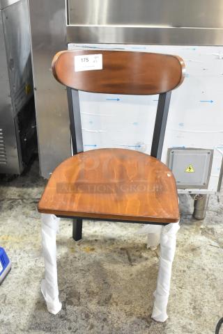 Brand new Cambro metal dining chair with wooden backrest and seat. Scratch and dent condition. Item tag reads "175 QTY XL".