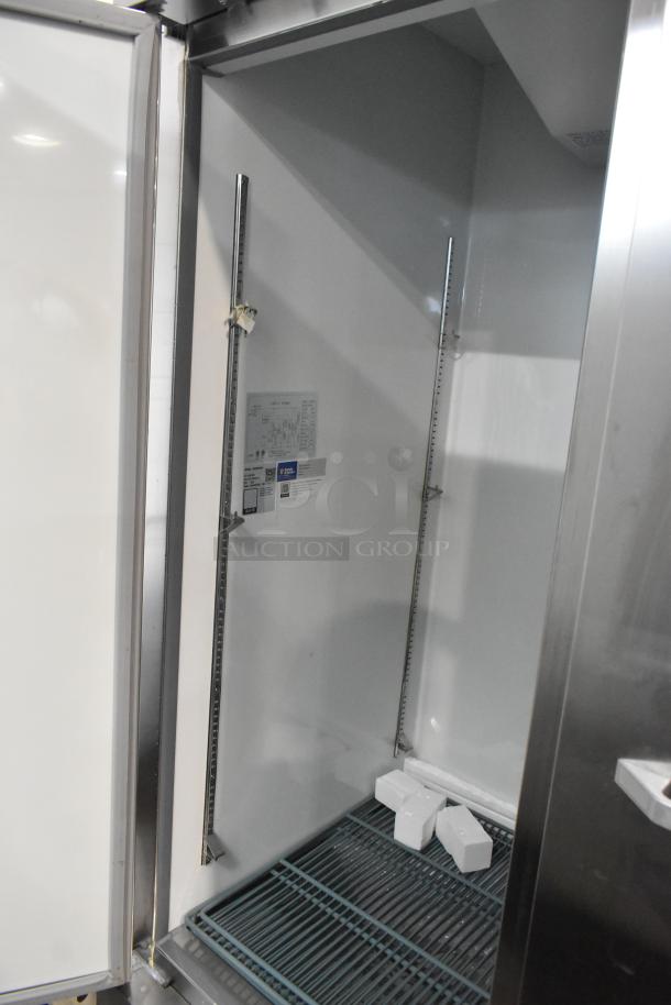 Brand new 2024 Mainstreet 829BMR49F stainless steel 2-door reach-in freezer with poly-coated racks, on commercial casters.