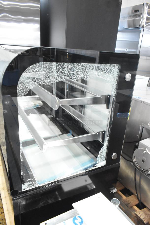 Brand new Avantco 193BC72HCB 72" black refrigerated bakery display case with curved glass, damaged side panel visible.