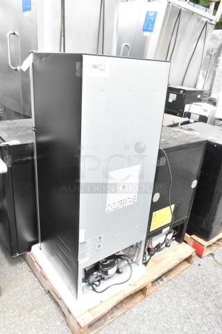 Four cooling appliances on pallets, including Arctic King ARM32D5ABB, US-KC1007BK freezer, Galanz GL46TS5E, and Black & Decker BCF32V, with visible branding and labels.