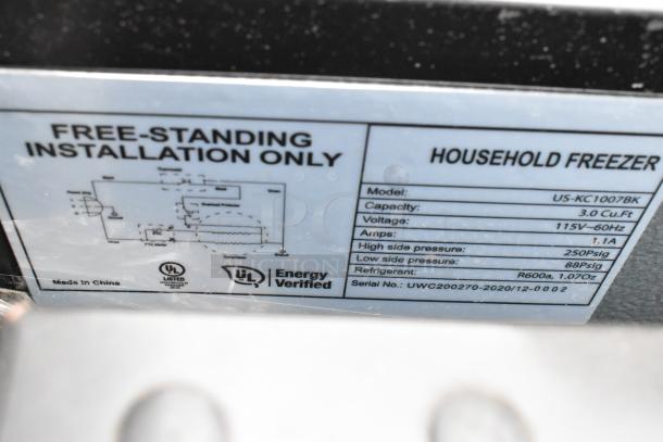 Label on US-KC1007BK freezer showing specs: 3.0 cu.ft capacity, 115V voltage, R600a refrigerant. UL Energy Verified.