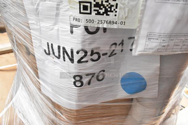 Plastic-wrapped pallet with visible shipping labels and QR code. Contains new Lancaster aluminum table and chairs.