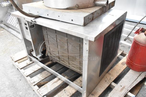 Metal commercial equipment on pallet, includes VXD33 exhaust hood, Ice Head, and Kitchen Knight II PCL-160 suppression tank.