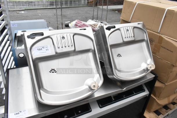 2 new Elkay EZSDWS_1G metal wall mount water fountains, 115V, 1 phase, slight scratch and dent. Auction label visible.