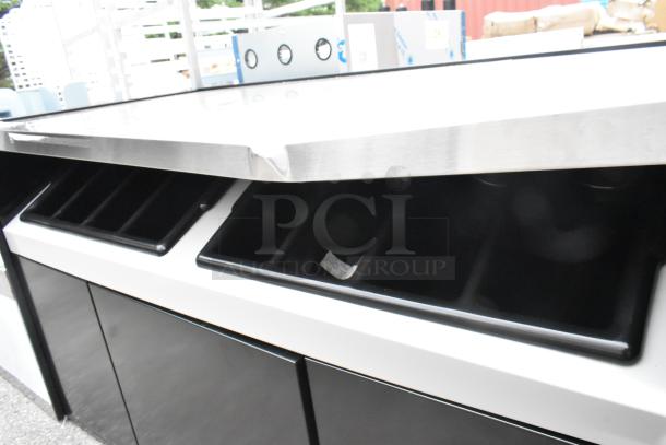 Brand new All State Manufacturing 168OCS490 coffee stand, 49"x23.25"x34", with scratch and dent. Features two condiment trays.