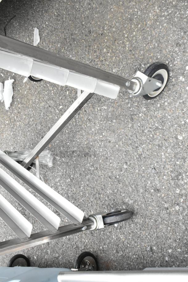 BRAND NEW SCRATCH AND DENT! Channel 402SN 15 Pan End Load Stainless Steel Nesting Bun / Sheet Pan Rack on Commercial Casters.