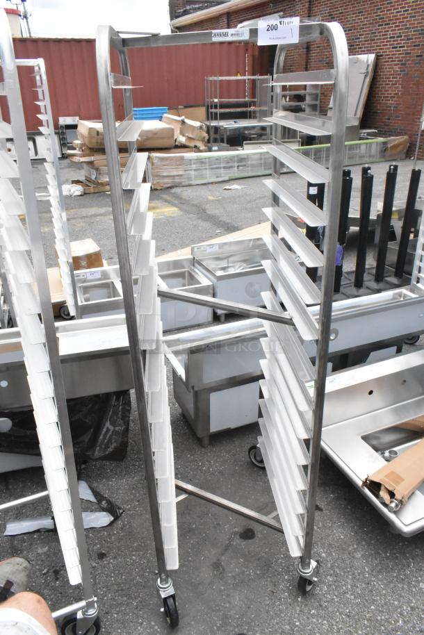 Brand new Channel 402SN 15 pan stainless steel nesting bun rack with scratches and dents, on commercial casters.
