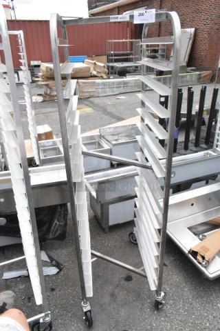 Brand new Channel 402SN 15 pan stainless steel nesting bun rack with scratches and dents, on commercial casters.