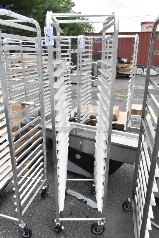 BRAND NEW Regency 600STPR20KD steam table pan rack, 20-pan capacity, aluminum, commercial casters, minor scratches visible.