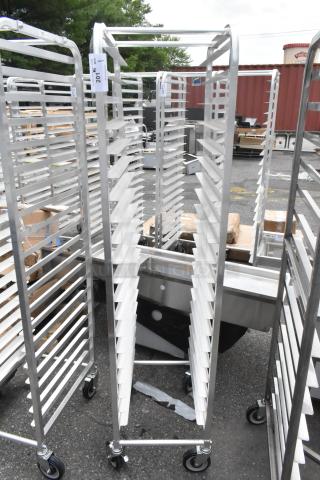 BRAND NEW Regency 600STPR20KD steam table pan rack, 20-pan capacity, aluminum, commercial casters, minor scratches visible.
