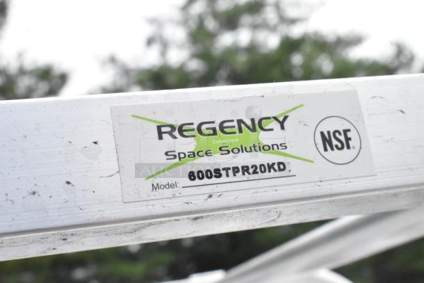 Regency 600STPR20KD steam table pan rack, aluminum, 20-pan capacity, commercial casters, scratch and dent, NSF label visible.