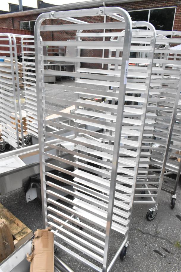 BRAND NEW Regency 600STPR20KD 20 Pan Aluminum Steam Table Pan Rack with minor scratches, on sturdy commercial casters.