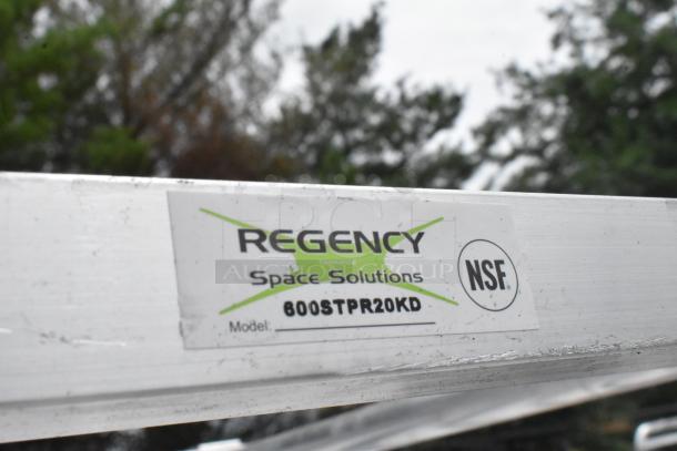 BRAND NEW Regency 600STPR20KD aluminum steam table pan rack with commercial casters, minor scratches and dents, NSF certified.