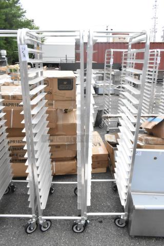 Two Regency 600STPR20KD 20 Pan Aluminum Steam Table Pan Racks with commercial casters, scratch and dent condition.