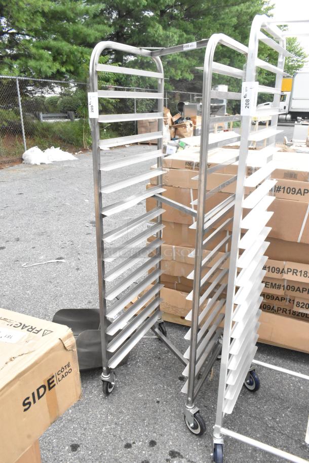 Brand new Channel 402SN 15 pan end load stainless steel nesting bun/sheet pan rack with visible dents, on commercial casters.