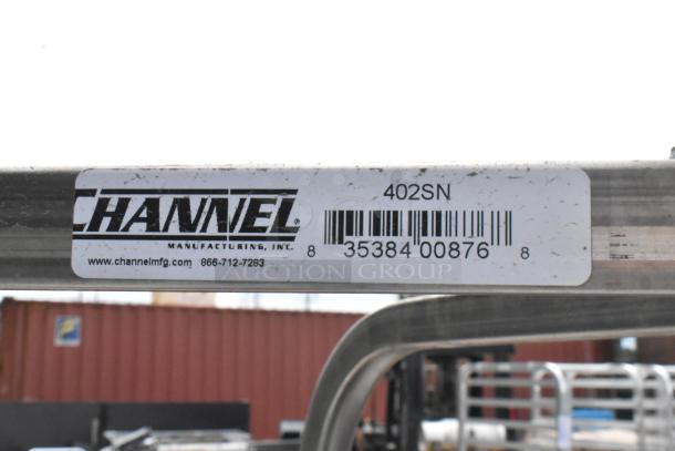 Brand new Channel 402SN 15 pan end load stainless steel sheet pan rack with commercial casters. Visible label indicates model.