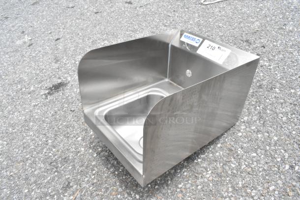 Brand new Kratos 28W-091 stainless steel single bay wall mount sink; slight cosmetic dents visible; tag indicates model.